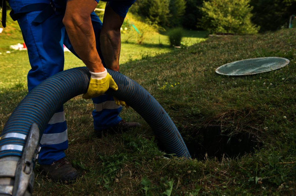 worker pumping from the ground Septic Inspections by Goodman Sanitation in Troutdale OR